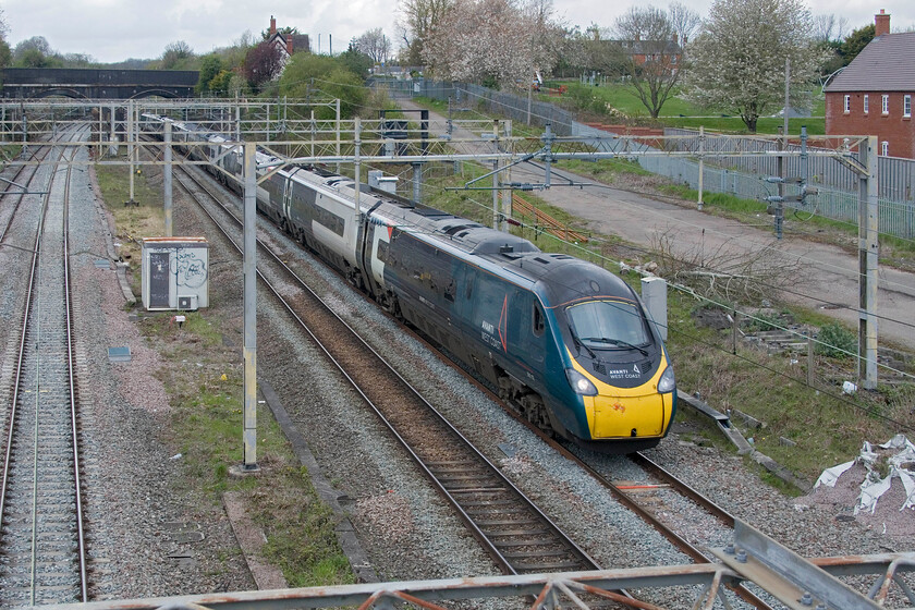 390112, VT 12.43 Liverpool Lime Street-London Euston (1A30, 5L), site of Roade station 
 With problems continuing to affect the up and down fast lines with trains be stopped and permitted to move at a walking pace almost from signal to signal control decided to move some to the slow lines meaning they would travel via Northampton. 390112 was one such train seen passing the site of Roade station working the 12.43 Liverpool to Euston Avanti service. This train arrived just five minutes late into Euston with most of the others, that stuck to the existing route, coming many minutes later. 
 Keywords: 390112 12.43 Liverpool Lime Street-London Euston 1A30 site of Roade station Avanti West Coast Pendolino AWC