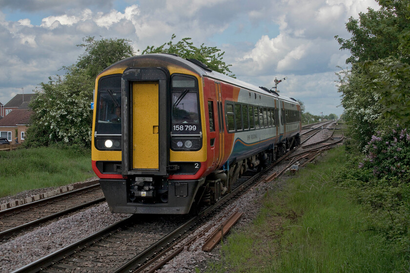 158799, EM 07.48 Liverpool Lime Street-Norwich (1L07, 26L), Manea station 
 For once this was an occasion when I wanted the sun to hide behind a cloud as I was caught totally on the wrong side for it. Once the barriers went down at Manea's level crossing one cannot cross from one platform to the other with no footbridge so I had to take this rather head-on photograph of 158799 as it passes working the 1L07 07.48 Liverpool to Norwich East Midlands service. 
 Keywords: 158799 07.48 Liverpool Lime Street-Norwich 1L07 Manea station East Midlands Railway