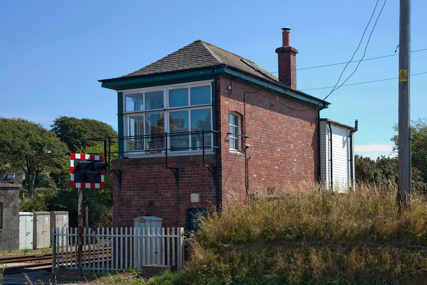 Dunragit signal box (LMS, 1927) 
 Dunragit signal box from the rear. This is an LMS Type 12 box built in 1927. Apart from the ugly toilet block extension on the end it is largely 'as-built'. It utilises the last surviving example of electric tablet working on the national railway network that is linked to Glenwhilly and Barrhill boxes. 
 Keywords: Dunragit signal box