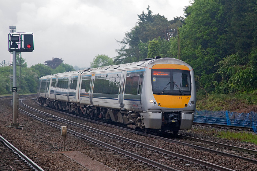 168112, CH 08.11 London Marylebone-Oxford (1T13, 1E), Princes Risborough station 
 168112 arrives at Princes Risborough station with the 08.11 Marylebone to Oxford. Whilst it was not actually raining at this point, the clouds above were pretty threatening. The light was also very flat and grey making decent photographs somewhat of a challenge! 
 Keywords: 168112 1T13 Princes Risborough station