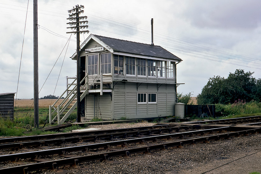 Helprinham signal box (GE, 1882) 
 Another superb GER signal box at Helpringham. This box dates from 1882 and was located close to the former station that closed relatively late in 1970. All of the boxes along this stretch of line were similar in design with all having a small hut at the foot of the steps that I can only assume was for the personal needs of the signalman? 
 Keywords: Helprinham signal box Great Eastern Railway GER