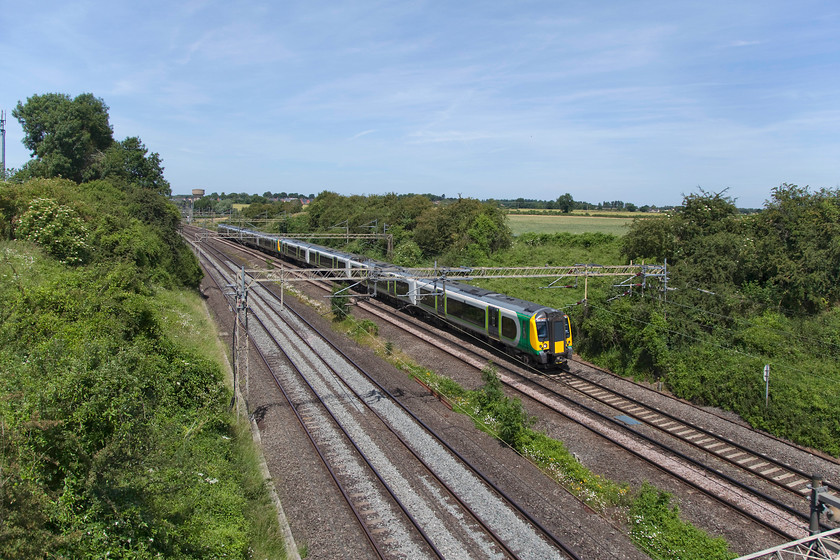 350243, 350121 & 350106, LN 12.25 Northampton-Milton Keynes ECS (5K20), Victoria Bridge 
 A twelve car ECS train composed of 350243, 350121 and 350106 passing Victoria Bridge, south of Roade, forming the 5K20 12.25 Northampton to Milton Keynes Central. 
 Keywords: 350243 350121 350106 5K20 Victoria Bridge