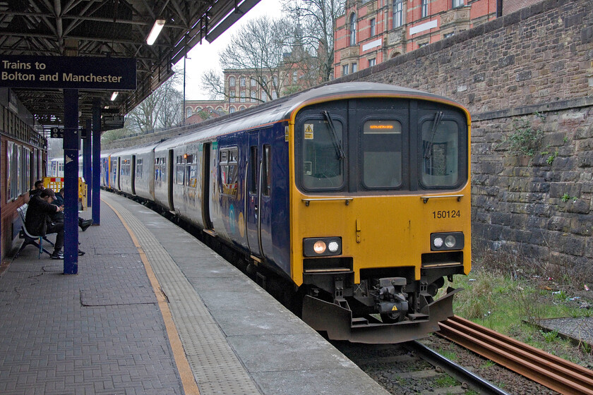 150124 & 150224, NT 14.39 Headbolt Lane-Blackburn (2N90, 2L), Wigan Wallgtae station 
 This is the first time that I have been on Wigan Wallgate station. The gateline staff member was not at all keen for us to go on to the platform advising us to seek permission to take photographs from the station supervisor. We went through the motions but could not find the said supervisor so took our photographs and left! 150124 and 150224 pause at the station working the 2N90 Headbolt Lane (opened on 5th October last year) to Blackburn service. The last time that I photographed the leading unit was deep in Great Western territory in Hereford back in 2011! 
 Keywords: 150124 150224 14.39 Headbolt Lane-Blackburn 2N90 Wigan Wallgtae station Northern Trains