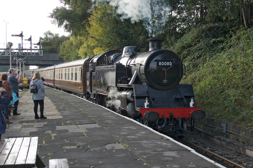 80080, 11.30 Heywood-Rawtenstall, Bury Bolton Street station 
 Former British Railways Standard class 4 2-6-4T number 80080 arrives at Bury Bolton Sreet leading the 11.30 Heywood to Rawtenstall service. There were a lot of passengers waiting to board what was already a very busy train. The front three coaches were in use for a dining experience so effectively out of use for other passengers. Also, another coach was reserved for a coach party so that left everybody else to cram into the remaining four coaches. We struggled to find a seat and some passengers were forced to stand. Whilst it is encouraging to see heritage lines enjoying such good patronage visitors do pay premium prices for the experience, so, then to be treated like a weekday commuter might not go down too well! 
 Keywords: 80080 11.30 Heywood-Rawtenstall Bury Bolton Street station