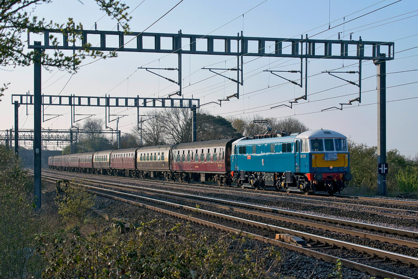 86259, outward leg of The Pennine Blackpool Express, 07.10 London Euston-Blackpool North (1Z86), Ashton Road bridge 
 Looking absolutely superb (as usual) 86259 'Les Rss/Peter Pan' passes on the down fast line between Roade and Ashton with The Pennine Blackpool Express. Utilising the the usual 1Z86 path, the train left Euston at 07.10 and ran to Blackpool. Here steam took the train to Hellifield via Wennington and then back again to Preston. Then, 86259 brought the train back south again to Euston where it arrived one minute early at 22.55. After taking this picture, I took a rapid walk home around the field behind me for a cup of tea and some breakfast. 
 Keywords: 86259 The Pennine Blackpool Express 07.10 London Euston-Blackpool North 1Z86 Ashton Road bridge