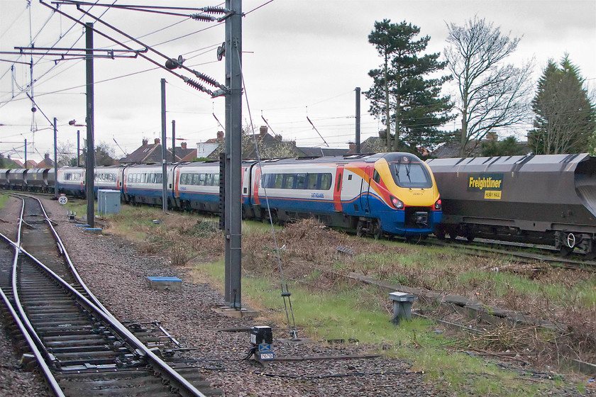 222013, stabled, Holgate sidings 
 East Midlands Trains operate one service to and from York every day except Sunday starting and ending at St. Pancras. This odd service seems a little strange and may well be part of their franchise agreement set up with the Department for Transport. After it arrives from St. Pancras, it is stabled before returning later in the day. As we leave York on our hst, the stabled Meridian, in the form of 222013, is seen in Holgate sidings next to some stored coal wagons. 
 Keywords: 222013 Holgate sidings EMT East Midlands Trains Meridian