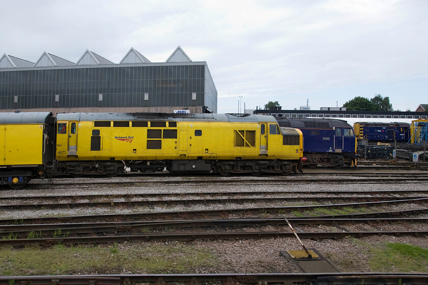 97303, 57603 & 08663, stabled, Derby REVL 
 A second European Railway Traffic Management System (ERTMS) fitted Class 97 stands at REVL's Derby headquarters in the form of 97303. It was converted, along with three other Class 37s, from 37178 back in 2007. Almost fully hidden behind the Class 97 is FGW's 57603 'Tintagel Castle' awaiting attention of some kind. This Class 57 was converted from 47349 and entered service in 2004. At the rear of the photograph is one of REVL's resident shunters 08663 a Horwich built member of the class dating from May 1959. 
 Keywords: 97303 57603 08663 stabled Derby REVL Railway Vehicle Engineering Ltd Network Rail Tintagel Castle