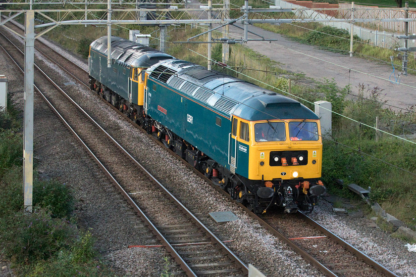 47749 & 47727, 16.01 Northampton EMD-Ferme Park (0Z46, 7L), site of Roade station 
 Having deposited a Class 360 at Northampton Kingsheath depot a little earlier 47749 'City of Truro' and 47727 'Edinburgh Castle/Caisteal Shun Eideann' return south as the 16.01 Northampton EMD to Ferme Park 0Z46 light engine move. The locomotives are seen passing the site of Roade's former station. Whilst the paint job and restoration of 47749 is impressive the front end is somewhat spoilt by the placing of the jumper cable sockets in the centre of the former headcode panel. 
 Keywords: 47749 47727 16.01 Northampton EMD-Ferme Park 0Z46 site of Roade station City of Truro Edinburgh Castle Caisteal Shun Eideann