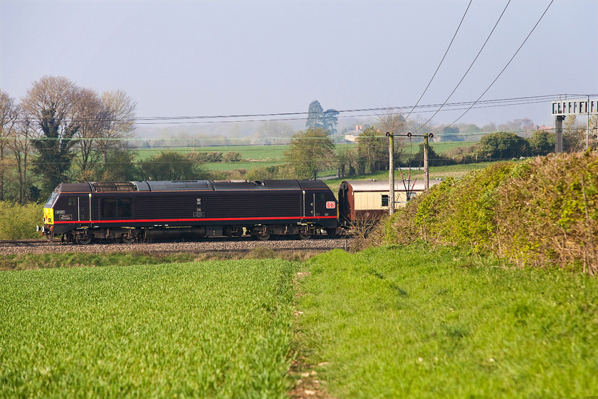 67005, 08.14 London Victoria-Runcorn (1Z39), between Roade & Ashton 
 67005 'Queen's Messenger' brings up the rear of the British Belmont Pullman charter running as 1Z39, the 08.14 London Victoria to Runcorn approaching Roade in Northamptonshire. It was carrying race-goers to the Grand National who would transferred by coach on arrival at Runcorn station. This special runs every year and I cannot quite work out why it doesn't go any further towards Aintree or even directly there; the charter sidings still exist if a little overgrown! 
 Keywords: 67005 08.14 London Victoria-Runcorn 1Z39 between Roade & Ashton