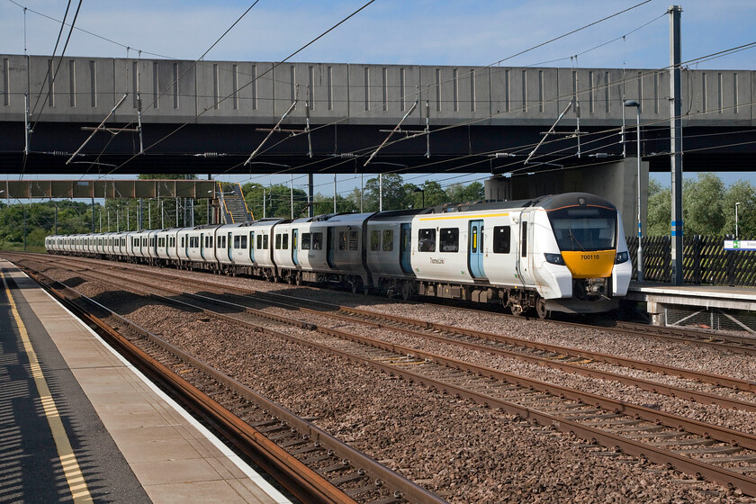 700110, TL 06.54 Horsham-Peterborough (9J14, 1L), Arlesey station 
 Under clear blue skies at Arlesey station on the ECML Thameslink's 700110 arrives working the 06.54 Horsham to Peterborough service. The station was opened on 03.10.88 on the site of the original station that was closed by British Railways in January 1959. The bridge carries the A507 over the railway linking Stoffold with Shefford. 
 Keywords: 700110 06.54 Horsham-Peterborough 9J14 Arlesey station Thameslink Desiro City