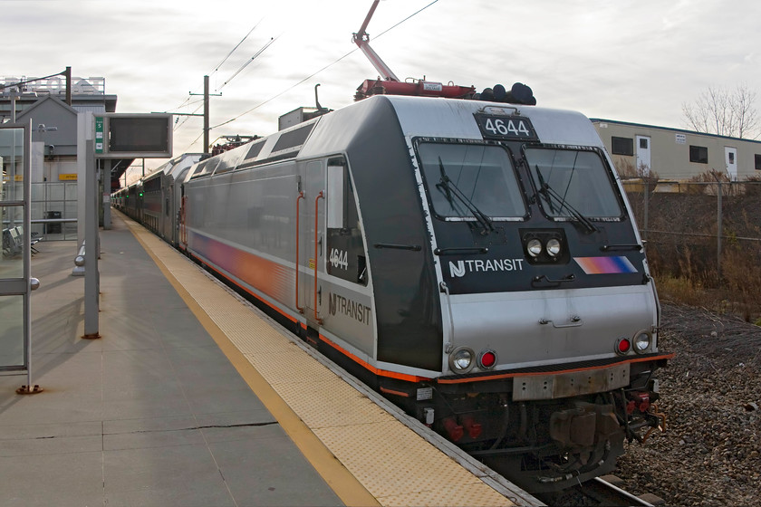 4644, 14.07 New York Penn-Trenton (3849), Newark International Airport station 
 We took the train from the dark depths of New York Penn station back to Newark International Airport station. This was the train that we took, the 14.07 Penn to Trenton 3849 service. It was being pushed at the rear by 4644, a German built Bombardier locomotive constructed between 2001 and 2002. This particular one is an AC electric example, there are also some bi-mode versions. 
 Keywords: 4644 14.07 New York Penn-Trenton 3849 Newark International Airport station