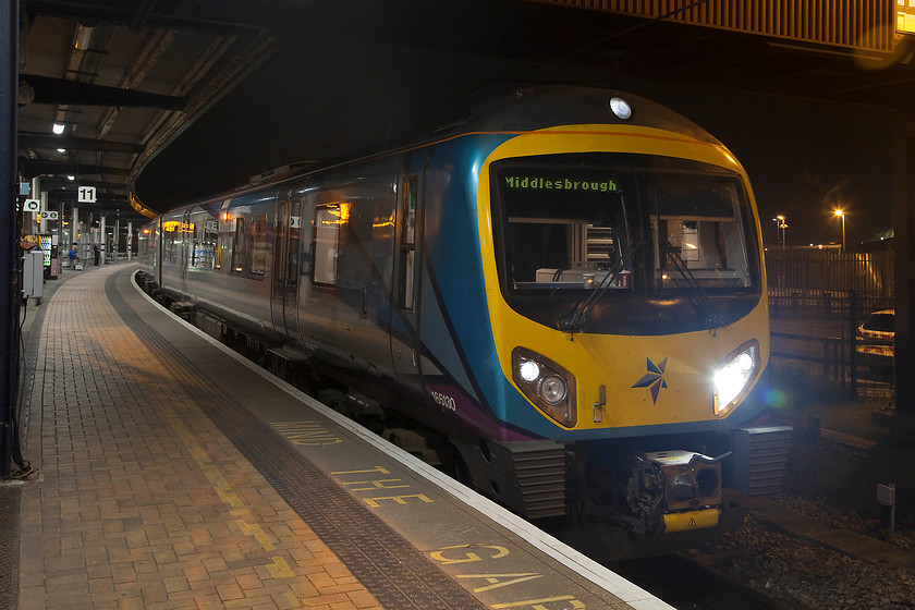 185130, TP 19.47 Manchester Airport-Middlesborough (1P89, 9L), York station 
 Running a little late, TransPennine Express' 185130 pauses at York station's platform eleven with the 19.47 Manchester Airport to Middlesborough. The camera coped well in the low lighting conditions, using 2000 ISO I hand-held the camera for 1/8 second utilising the lens' image stabiliser function. There was a little digital noise to take care of but close examination reveals that the picture is pin-sharp. I am not sure as to whether this is my steady hand or the clever in-camera technology! 
 Keywords: 185130 19.47 Manchester Airport-Middlesborough 1P89 York station