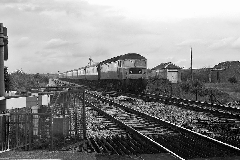 47502, unidentified down working, Athelney level crossing 
 Taken at Athelney level crossing that is on the Somerset Levels, 47501 heads westwards with an unidentified down express composed of Mk. II stock. This particular class 47 is still with us today and is preserved as 47715 on The Wensleydale Railway. It has just been repainted into Network Southeast livery and re-named 'Haymarket'. 
 Keywords: 47502 unidentified down working Athelney level crossing