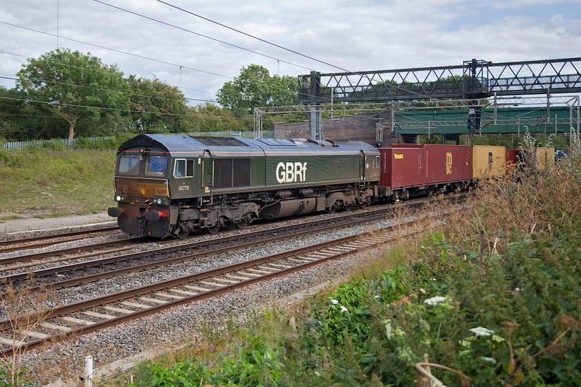 66779, 12.05 London Gateway-Hams Hall (4M46, 10L), Gordon's Lodge 
 I saw 66779 'Evening Star' a couple of weeks ago at Victoria bridge and commented on its filthy front end. Knowing that GBRf take care to ensure that their locomotives are presented well I would have thought that they may have given it a clean since then? It is seen here at Gordon's Lodge just north of Hanslope Junction leading the 4M46 12.05 London Gateway to Hams Hall Freigtliner. 
 Keywords: 66779 12.05 London Gateway-Hams Hall 4M46 Gordon's Lodge GBRf Evening Star Freightliner