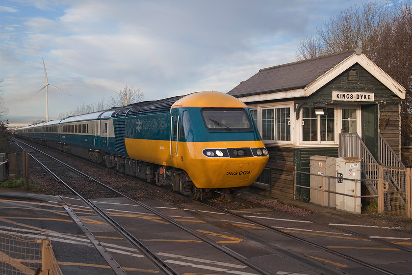 43206 & 43006, 04.41 Craigentinny-Ely Papworth Sidings (5L46), Kings Dyke crossing 
 This is what the early start and drive from Northampton on New Year's Eve was all about! Just catching some rare winter sunshine, 43206 leads the 04.41 Craigentinny to Ely Papworth Sidings empty stock move past Kings Dyke level crossing. The power cars and stock are moving to the storage facility at Ely having been taken out of service a couple of weeks previously having worked their final trains being in connection with the four-day final railtour, see.... https://www.ontheupfast.com/v/photos/21936chg/C360428004/x85-ecml-hst-farewell-let-s-go-round Surely, set EC56 is too good to scrap having been so well painted and prepared for the final railtour? 
 Keywords: 43206 43006 04.41 Craigentinny-Ely Papworth Sidings 5L46 Kings Dyke crossing