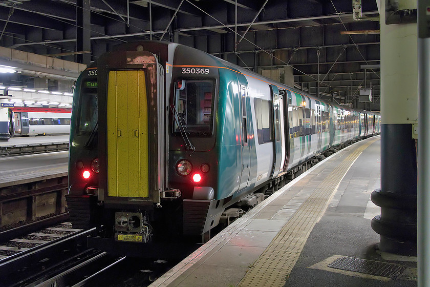 350369 & 350258, LN 22.24 London Euston-Birmingham New Street (2N31, 1L), London Euston station 
 Our train back from London to Northampton waits at Euston's platform ten formed of 350369 and 350258. The 22.24 Euston to Birmingham New Street was busy when we left but there were spare seats, by the time we reached Northampton, it had quietened down well with most passengers sleeping! This photograph again clearly illustrates the problems of photographing London Northwestern's new front end livery in poor lighting; it looks awful! 
 Keywords: 350369 350258 22.24 London Euston-Birmingham New Street 2N31 London Euston station