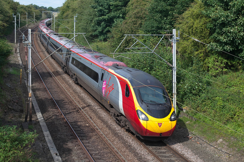 390131, VT 13.35 Manchester Piccadilly-London Euston (1A39, 23L), Dodford Lane Bridge SP623607 
 390131 'City of Liverpool' takes the Weedon loop past Dodford Road bridge working the 13.35 Manchester Piccadilly to Euston. After a grey and dismal morning, it was nice to see the sun coming out and brightening things up! 
 Keywords: 390131 1A39 Dodford Lane Bridge SP623607