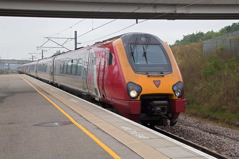 221118 & 221103, VT 09.10 London Euston-Holyhead (1B83), Milton Keynes Central station 
 The first leg of our journey to Edinburgh was aboard this train, the 09.10 Euston to Holyhead service that we took as far as Crewe. Here, 221118 and 221103 'Christopher Columbus' arrive at Milton Keynes station. As regular readers will know, I am not a fan of these Voyagers, finding them cramped and particularly noisy; never mind, we only had to endure one for just over an hour or so! 
 Keywords: 221118 221103 09.10 London Euston-Holyhead 1B83 Milton Keynes Central station