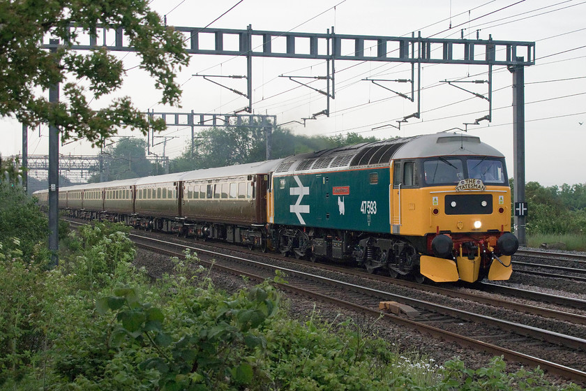 47593, outward leg of The Settle and Carlisle Coastal Statesman, 05.42 Milton Keynes Central-Appleby (1Z25) Ashton Road bridge 
 47593 'Galloway Princess ' looks resplendent in its BR large logo livery complete with a Scottish Region scottie dog. It is seen passing between Ashton and Roade on the WCML with Statesman operated The Settle and Carlisle Coastal Statesman that has just left its start point at Milton Keynes. 
 Keywords: 47593 The Settle and Carlisle Coastal Statesman 05.42 Milton Keynes Central-Appleby 1Z25 Ashton Road bridge