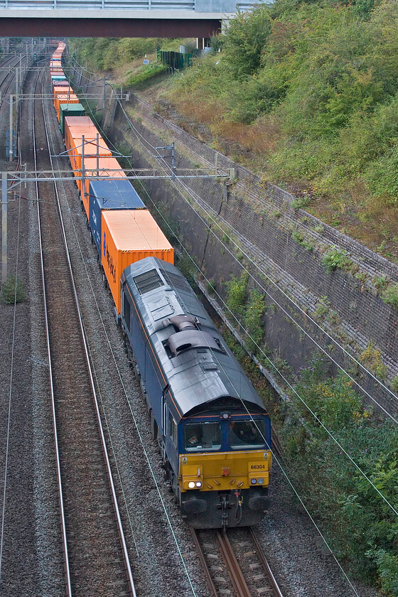 66304, 13.57 Birch Coppice-London Gateway (4L68, 3L), Roade cutting 
 Formally a DRS locomotive that itself took it on from the defunct operator Jarvis who themselves had taken over Fastline Freight 66304 leads the 13.57 Birch Coppice to London Gateway 4L68 Freightliner. The Class 66 still wears the plain version of DRS' livery (it never received their fancy full livery) but is unbranded now operated by GBRf; I wonder what plans they have for this and the other five 6630Xs that were originally ordered by Fastline back in 2007. 
 Keywords: 66304 13.57 Birch Coppice-London Gateway 4L68 Roade cutting