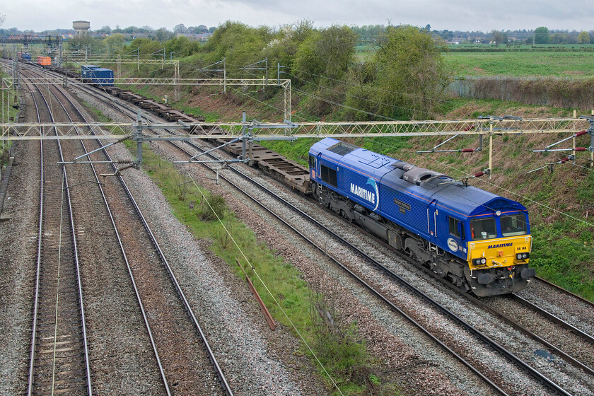 66148, 04.00 Wakefield Europort-Southampton Western Docks (4O43, 71L), Victoria bridge 
 Due to the lengthy closure and protracted repairs to the abutments that carry Nuneham viaduct that spans the Thames just north of Culham between Oxford and Didcot all freight has been diverted with the WCML taking most of the strain. This has brought all sorts of interesting freight close to home that is not usually captured by my lens. One such example is seen passing Victoria bridge just south of Roade is the 4O43 04.00 Wakefield Europort to Southampton Western Docks led by 66148 Maritime Intermodal Seven 
 Keywords: 66148 04.00 Wakefield Europort-Southampton Western Docks 4O43 Victoria bridgeMartime Express Maritime Intermodal Seven