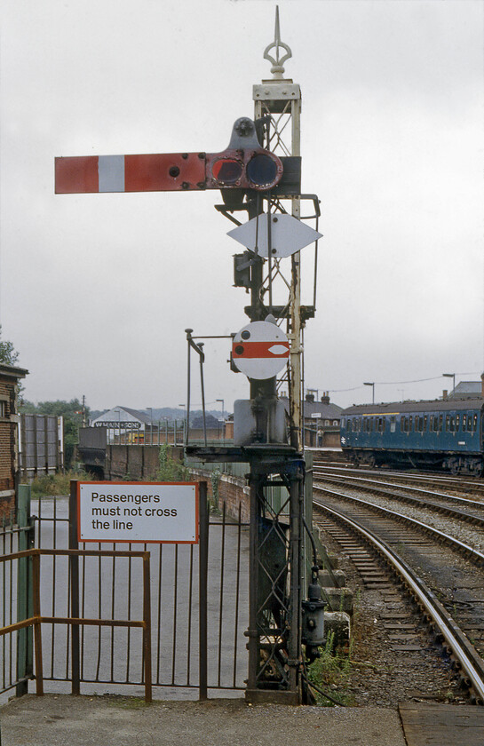 Up starter & disk signal, Salisbury station 
 The final photograph of the day of my trip to Salisbury shows one of the station's up starter signals. The upper quadrant is attached to a nice latticed post that is typical of the L&SWR. Also attached to the post is a shunting disc signal. The marvellous mechanical infrastructure was about to be swept away with just nine days before the Salisbury area's colour lights and panel (inside a small 'box' on the station's platform two) were to begin operations. 
 Keywords: Up starter disk signal Salisbury station