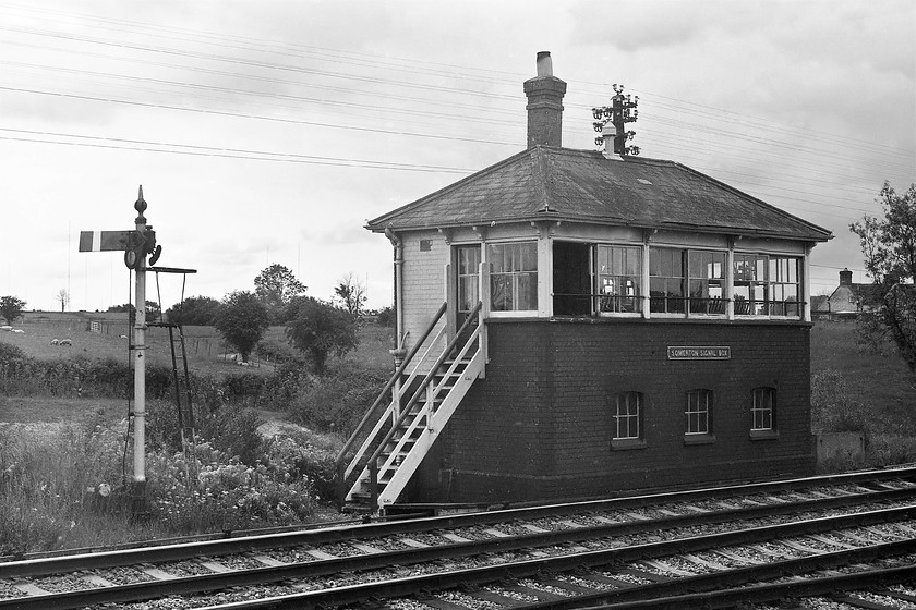 Somerton signal box (GW, c.1906) 
 The lovely signal box at Somerton. The box was one of the GWR's brick-built Type 7B boxes. It opened circa 1906 and was abolished in February 1985 when the area came under the control of Westury PSB. In 1942 a forty-four lever Vertical Tappet frame was installed. I love the short Western Region down home signal complete with it finial that, if the picture was in colour, would have been seen clearly painted red. 
 Keywords: Somerton signal box