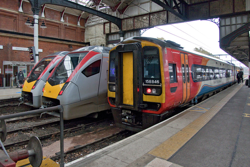 755329, LE 15.36 Norwich-Great Yarmouth (2P26, 2E), 755406, stabled & 158846, EM 15.48 Norwich-Liverpool Lime Street (1R54, 10L), Norwich station 
 The two new Class 755 units do make 158846 look very old as they stand side by side on the blocks at Norwich station. Dating from 1990, the Class 158 will soon work the 14.58 to Liverpool Lime Street running as 1R54. Next to the BR era Express Sprinter are the newcomers in the form of 755406 that is stabled between duties and 755329 that is about to leave working the 15.36 to Great Yarmouth. 
 Keywords: 755329 15.36 Norwich-Great Yarmouth 2P26 755406 158846 15.48 Norwich-Liverpool Lime Street 1R54 Norwich station East Midlands Railway Greater Anglia