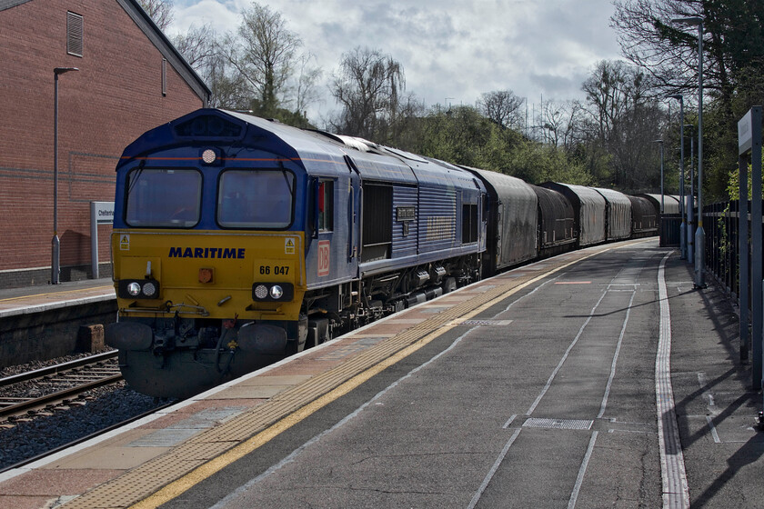 66047, 11.45 Margam-Round Oak (6M41, 11E), Cheltenham station 
 Hurrah! A photographic cop for this 66 in the Maritime livery! 66047 'Maritime Intermodal Two' leads the 6M41 11.45 Margam to Round Oak loaded steel coil train very slowly through Cheltenham station. The train is composed of a mixture of BYA and Sfhimmns hooded wagons in the 46XX series but I am not sure of their classification; can anybody please advise? With 66047 now in the photographic bag this just leaves 66162 to capture; I think that I'll need to speak to my railway colleague, Mike, who has access to TOPS and hunt it down! 
 Keywords: 66047 11.45 Margam-Round Oak 6M41 Cheltenham station Maritime Maritime Intermodal Two