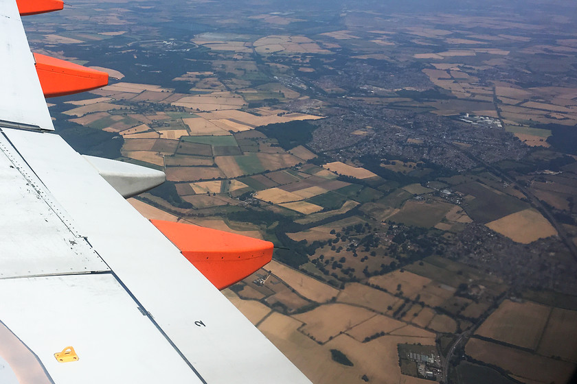 MML & Flitwick, from EZY2158 
 Taken from Easy Jet flight EZY2158 on the approach to Luton Airport. Sweeping from bottom right to middle top is the MML as it passes through Flitwick. Close examination reveals the line disappearing through the Ampthill tunnels.