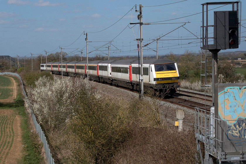 82118, 82127 & 90001, 08.42 Norwich Crown Point-Crewe HS (5Z90, 68E), Milton Crossing 
 The rear end of the 08.42 Norwich Crown Point to Crewe holding sidings transfer move heads north past Milton crossing in Northamptonshire. In an exact copy of yesterday's formation, the consist has two DVTs, one at the rear and one third from the end. For the record, the entire consist is, 90001, 11068, 11091, 11075, 11070, 11098, 11087, 82127, 12114 and 82118. Whilst the Class 90 will see further use having been bought by LSL the future of the stock and the DVTs is more uncertain. It is believed that some of the stock will be used for emergency service training. 
 Keywords: 82118 82127 90001 08.42 Norwich Crown Point-Crewe HS 5Z90 Milton Crossing Greater Anglia LSL Locomotive Services Limited DVT Crown Point