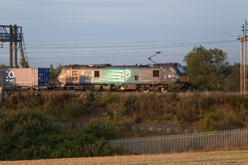 88004 03.40 Tilbury-DIRFT (4M77, 12E), between Roade & Ashton 
 Catching the first vestiges of early morning sun 88004 'Pandora' passes through the Northamptonshire countryside leading the 03.40 Tilbury to Daventry 4M77 Tesco service. This service is usually electrically hauled by a DRS Class 88 but like the previous photograph, it is not a train that I have captured very often due to its antisocial timing! 
 Keywords: 88004 03.40 Tilbury-DIRFT 4M77 between Roade & Ashton DRS Pandora