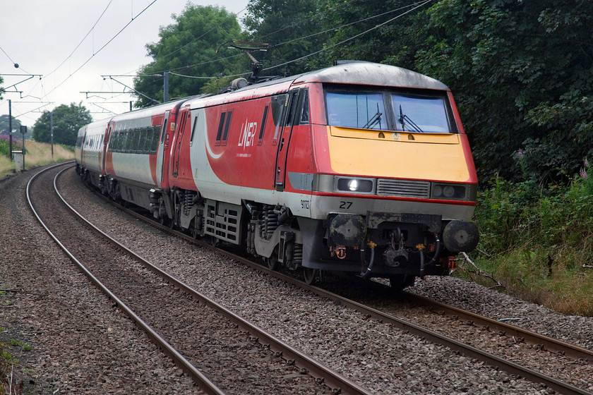 91127, GR 14.30 London King`s Cross-Edinburgh Waverley (1S21, 2E), Pegswood station 
 91127 heads north with the 14.30 King's Cross to Edinburgh service through Pegswood station. Pegswood is a former mining village just northeast of Morpeth. 
 Keywords: 91127 14.30 London King`s Cross-Edinburgh Waverley 1S21 Pegswood station