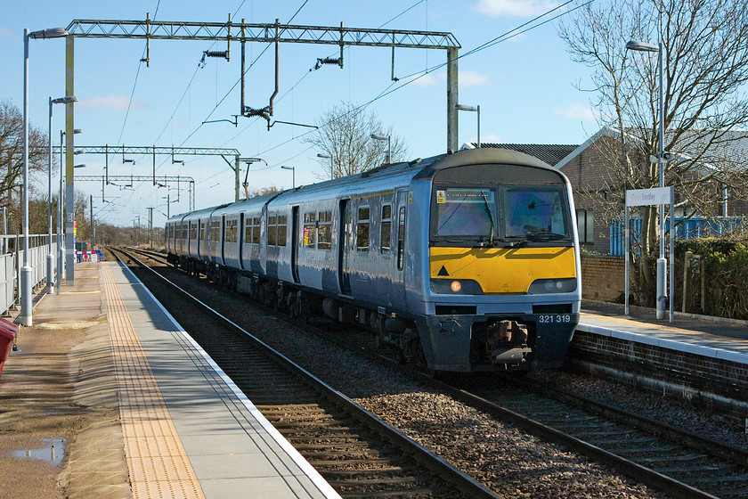 321319, LE 11.00 Walton-on-the-Naze-Colcehster (2F35), Great Bentley station 
 321319 arrives at Great Bentley with the 11.00 Walton-on-the-Naze to Colchester local service. Notice the uneven platform, work was being undertaken to improve the station and lots of resurfacing was being carried out by orange-clad contractors. 
 Keywords: 321319 11.00 Walton-on-the-Naze-Colcehster 2F35 Great Bentley station