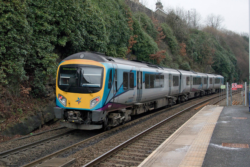 185123, TP 11.25 Liverpool Lime Street-Newcastle (9E11, RT), Mossley station 
 185123 forms the 11.25 Liverpool to Newcastle working as it passes through Mossley station. On this rather grey winter's day, the location of Mossley station fairly deep in a valley climbing the Pennines made for this rather dark and lifeless picture. 
 Keywords: 185123 11.25 Liverpool Lime Street-Newcastle 9E11 Mossley station