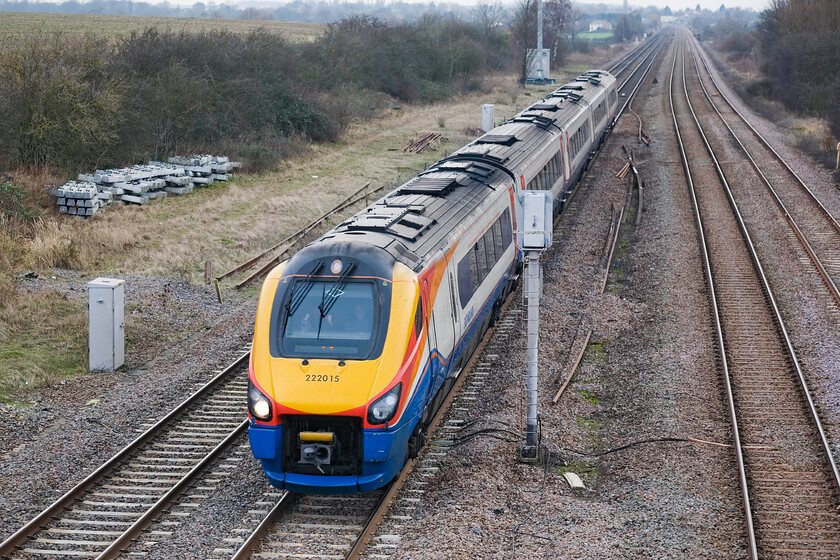 222015, EM 12.02 Nottingham-London St. Pancras, Lower Farm Road, Bromham TL028518 
 Cold, hungry and now a little bored waiting for a failed railtour this is my last photograph at Bromham near Bedford! 222015 speeds southwards working the 12.02 Nottingham to St. Pancras EMR service. Close examination of the driver's cab appears to show him waving a white handkerchief (or some such), perhaps a subliminal message for me to give up and go home! 
 Keywords: 222015 12.02 Nottingham-London St. Pancras Lower Farm Road Bromham TL028518 EMR East Midland Meridian