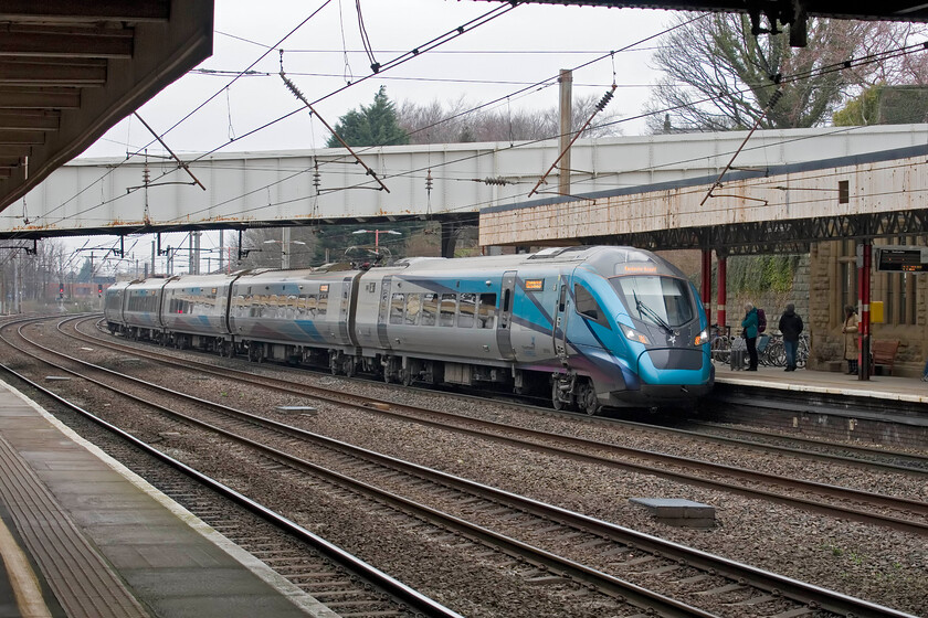 397005, TP 09.06 Glasgow Central-Manchester Airport (1M84, RT), Lancaster station 
 Now state-owned, TPE's 397005 arrives at Lancaster station working the 09.06 Glasgow Central to Manchester Airport service. A very grey and dismal early March day in the northwest is brightened up a little by the bright and modern-looking livery of the Class 397. 
 Keywords: 397005 09.06 Glasgow Central-Manchester Airport 1M84 Lancaster station Trans Pennine Express