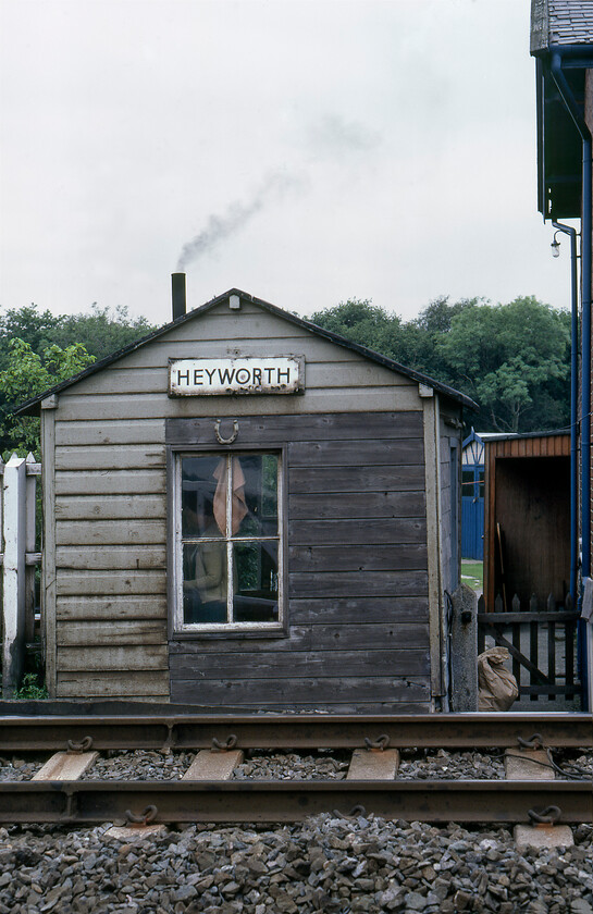 Crossing keeper's hut, Heyworth SE587138 
 Heyworth crossing signalman's hut is seen complete with its fire obviously lit. The hut was adjacent to the house in which the signalman lived in a remote spot some seven miles north of Doncaster. Today the charming rickety hut has gone with the space now part of the garden of the house. The signalman now has an equally dilapidated Portakabin on the other side of the road that is to the left in this photograph. 
 Keywords: Crossing keeper's hut Heyworth SE587138