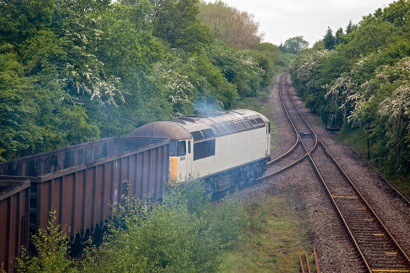 56091, 10.55 Calvert-Didcot PS (6Z91), site of Calvert station site 
 After spending some time idling 56091 makes a slow, laboured and smokey departure from the remains of Calvert station. It is leading the 10.55 Calvert to Didcot power station MBA box wagons that are returning empty to be re-loaded with more flyash. The flyash is being cleared as part of the decommissioning of the power station leading to its eventual demolition. The flyash is being disposed of in the vast Calvert landfill site. 
 Keywords: 56091 10.55 Calvert-Didcot PS (6Z91), site of Calvert station site