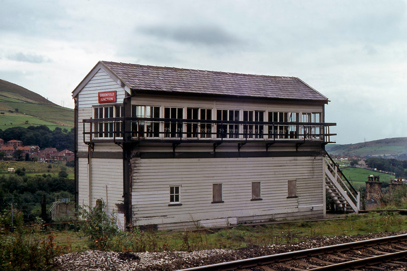 Greenfield Junction signal box (LNWR, 1888) 
 In an effort to capture 46229 'Duchess of Hamilton' running light engine back to York after leading the Liverpool to Manchester Victoria special earlier we raced to Greenfield to the northeast of Manchester. Unfortunately, we missed its passage but I did manage this photograph of the rather grand, if a little decayed, Greenhill Junction signal box. Still wearing its BR (M) enamel plate it was a LNWR box dating from 1888 that closed in 1999. 
 Keywords: Greenfield Junction signal box LNWR London and North Western Railway