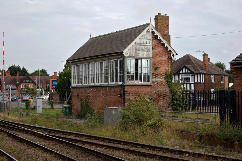 Sleaford East signal box (GN, 1882) 
 Whilst Sleaford East signal box ceased to actually control train movements in 2014 when the Lincoln PSB opened it still appears to be open witnessed by a railway employee inside and the end window being open. I am not sure what role it fulfils but it is possibly just for the operation of the gates as there appeared to be no CCTV present to remotely monitor them; advice, please. Whatever its use, its future is assured as it is a Grade II listed structure. It looks as though it could do with a lick of paint though! 
 Keywords: Sleaford East signal box