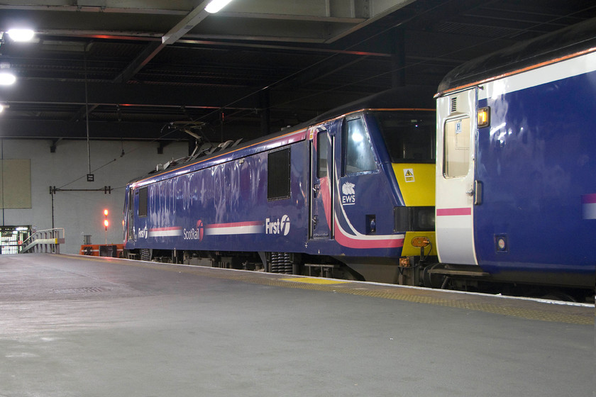 90019, SR 19.34 Wembley-London Euston ECS (5S95), London Euston station 
 A reverse angle view of 90109 taking a rest on the blocks at Euston after the short journey down from Wembley. It had brought the empty coaching stock in that will later form the Lowland sleeper service to Glasgow Central and Edinburgh Waverley. I have yet to travel on one of the Scottish sleeper services but this is something that Andy and I hope to rectify soon. 
 Keywords: 90019 19.34 Wembley-London Euston ECS 5S95 London Euston station