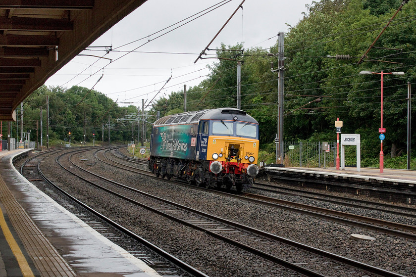 57307, 09.16 Carlisle-Preston LE (Z057), Lancaster station 
 I stepped out of our train to Carlisle at Lancaster station to photograph some units in the north-facing bay platforms just as 57307 'Lady Penelope' came around the curve from the north on the centre road. It was working the 09.16 Carlisle to Preston 0Z57 light engine move. At Preston, it would take up its Thunderbird post ready to rescue any failed trains on the WCML. Previously developed and operated by Virgin, these dedicated class 57s now are operated by DRS from their Carlisle Kingmoor base. 
 Keywords: 57307 09.16 Carlisle-Preston Z057 Lancaster station