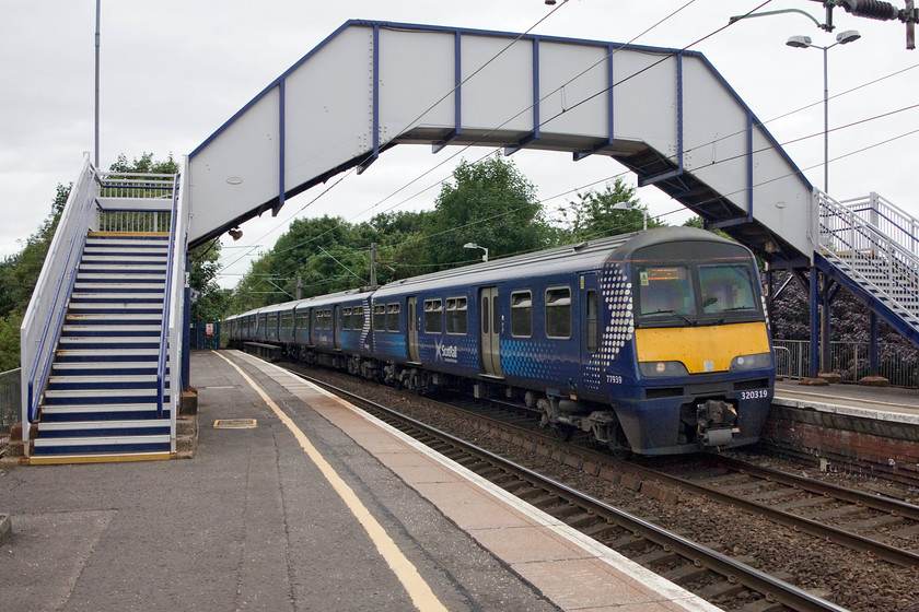 320319 & 318267, SR 12.03 Dalmuir-Rutherglen (2R30, 6L), Jordanhill station 
 Scotrail 320319 and 318267 come into Jordanhill station under the footbridge working the 12.03 Dalmuir to Rutherglen working. The intensity of service on the North Clyde section of the Glasgow network was a surprise given that that it was the middle of the day 
 Keywords: 320319 318267 2R30 Jordanhill station