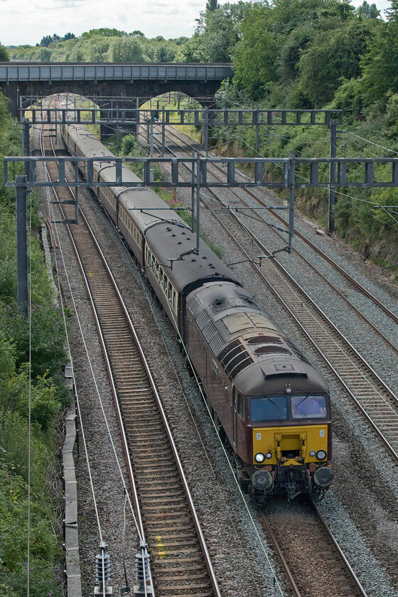 57314, 11.18 Central Milton Keynes-Northampton (5Z60, 1E), Hyde Road bridge 
 Having deposited its passengers at Milton Keynes who themselves then joined a fleet of coaches for onward travel to Silverstone for the British Grand Prix the empty train is seen heading north towards Northampton as the 5Z60 11.18 from Milton Keynes. Here it would then return south again for stabling and servicing in Wolverton Works' Centre sidings. The train is seen passing Roade's Hyde Road bridge with 57314 'Conway Castle'. 
 Keywords: 57314 11.18 Central Milton Keynes-Northampton 5Z60 Hyde Road bridge Conway Castle