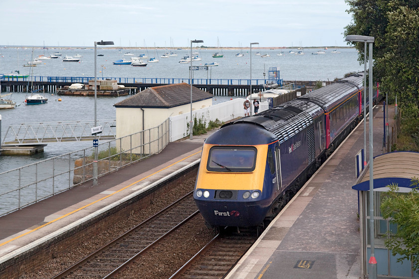 43177, GW 16.57 Plymouth-London Paddington(1A92, 1L), Starcross station 
 43177 leads the 16.57 Plymouth to Paddington HST working through Starcross station. Even though the train isn't perfectly framed in this image, I like the many boats scattered about moored in the Exe Estuary behind. 
 Keywords: 43177 1A92 Starcross station