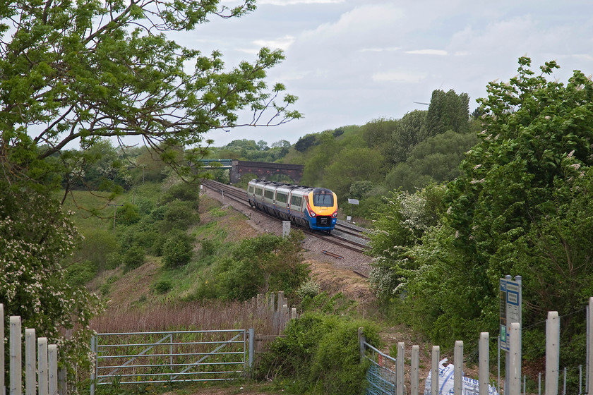 222021, EM 10.26 London St. Pancras-Sheffield (1F23, 1E), Souldrop Road Bridge SP986609 
 222021 climbs up Sharnbrook bank working the 10.26 St. Pancras to Sheffield. In 1980 I camped at this spot on the way back from chasing Deltics on the ECML. I then went on to do some of the MML when the Peaks still ruled and there was mechanical signalling; another era! 
 Keywords: 222021 1F23 Souldrop Road Bridge SP986609