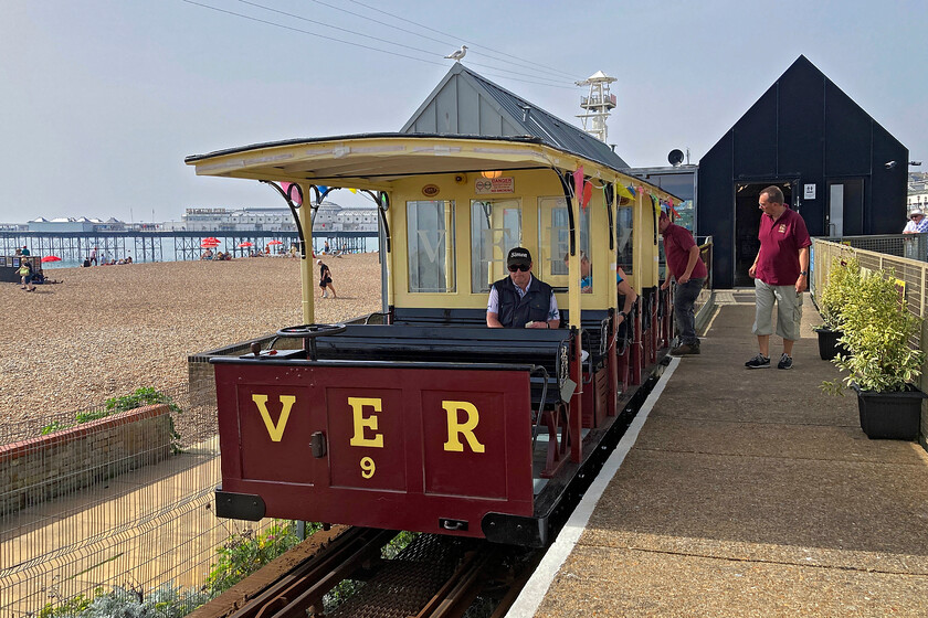 Car 9, Aquaium-Black Rock working, Aquaium station 
 With Brighton Pier in the background Car 9 waits at VER's Aquarium station to work the next service along the just over a mile track to Black Rock. My wife and I travelled on this service taking in the fantastic late summer weather. The VER is a popular visitor attraction at Brighton with two trains running on any one day throughout the season. Notice, what appears to be, a gabled roof on top of Car 9 complete with a resident seagull! This is an illusion as it actually the roof of the Aquarium station and small visitors centre with Car 9 having a flat roof. 
 Keywords: Car 9 Aquarium-Black Rock working Aquarium station VER Volks Electric Railway