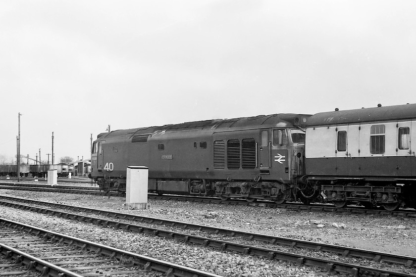 50039, 13.30 London Paddington-Penzance, Westbury station 
 At Westbury station, 50039 'Implacable' leaves Westbury station with the 13.30 Paddington to Penzance. In the background two class 47s are seen on-shed at Westbury's depot. 
 Keywords: 50039 13.30 London Paddington-Penzance Westbury station