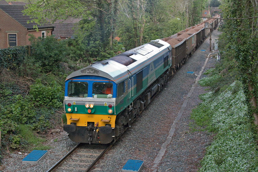 59004, 09.42 Whatley Quarry-Westbury Down (18E), Frome Sheppards bridge 
 59004 'Paul A Hammond' leads the 09.42 Whatley to Westbury loaded stone train through Frome taken from Shepperds (sic) bridge. Whilst this working is timetabled short, on arrival at Westbury it then will make its way onwards towards the London area. This location is a very quiet one and on this spring morning was particularly popular with birds who all appeared to be talking with each other at full volume and who seemed unperturbed by the passing of a huge and noisy stone train! 
 Keywords: 59004 09.42 Whatley Quarry-Westbury Down Frome Sheppards bridge Paul A Hammond